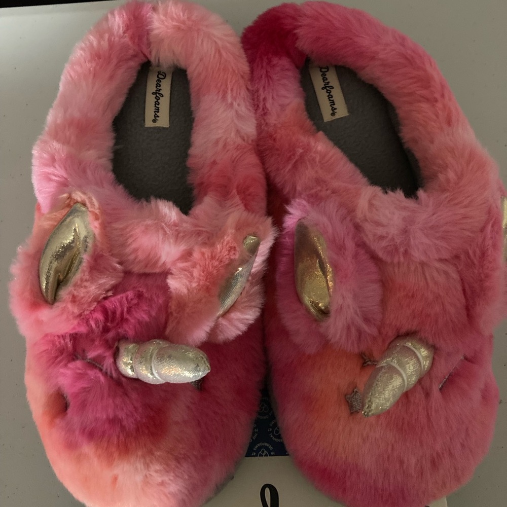 Pink fuzzy unicorn slippers by Dearfoams